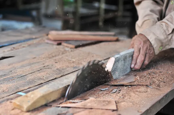 Carpenter working on woodworking machines — Stock Photo, Image