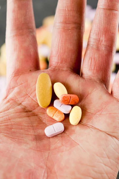 Multi colorful pill on hand — Stock Photo, Image