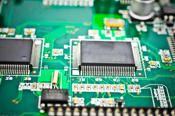 Placa de circuito con componentes electrónicos macro fondo —  Fotos de Stock