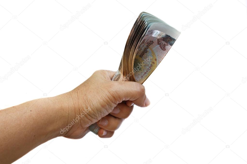 Hand holding thai money.