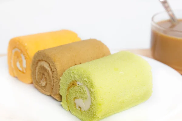 Jam swiss roll cake three flavors. — Stock Photo, Image