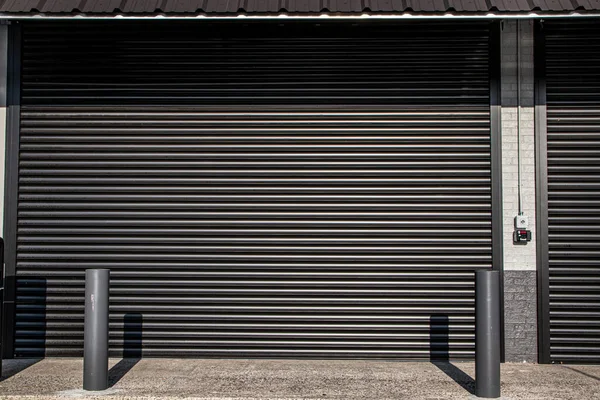 A roll down steel security door to protect a store in and urban area