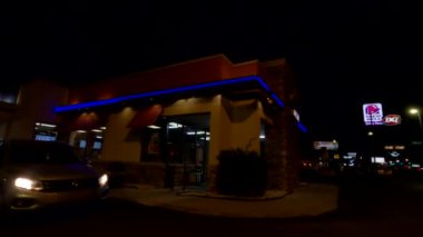 Augusta, Ga USA - 02 11 21:  Pan around to the front of a Dairy Queen fast food restaurant at night