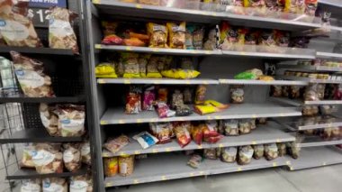Augusta, Ga USA - 01 09 22: Walmart empty shelves supply chain issues chip section