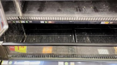 Grovetown, Ga USA - 01 15 22: Georgia snow scare Kroger retail grocery store pan of a dirty empty meat case section