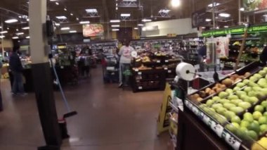 Grovetown, Ga USA - 01 15 22: Georgia snow scare Kroger retail grocery store customers and workers in produce area