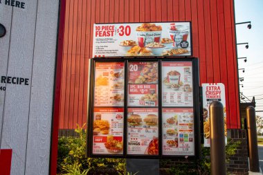 Wrens, Ga USA - 07 25 21: KFC fast food fried chicken restaurant Drive thru menu exterior