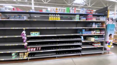 Grovetown, Ga USA - 05 13 22: Walmart Retail store Baby formula section left pan empty shelves limited supply Abbott Recall