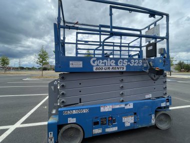 Augusta, Ga USA - 05 07 22: Scissor lift in a parking lot side view