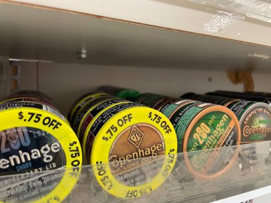 Grovetown, Ga USA - 06 21 22: Retail store variety smokeless tobacco cans on a shelf