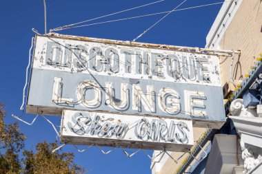 Augusta, Ga USA - 11 17 21: Downtown Augusta Georgia clear blue sky discotheque bar and lounge sign