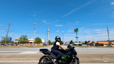 Augusta, Ga USA - 03 03 21: Person riding a motorcycle side view