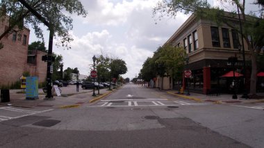 Augusta, Ga USA - 07 29 21: Pan of Downtown Augusta Georgia street view historic vintage buildings people and cars covid delta narrow road