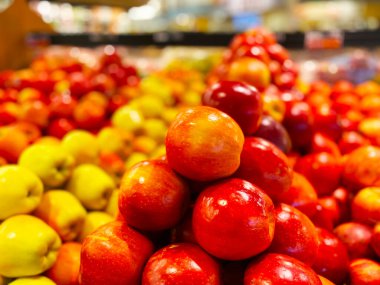 Piles of fresh colorful bright apples retail store fresh market
