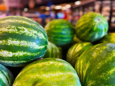Fresh watermelons on display retail grocery store in Georgia USA