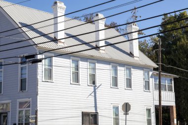 Old vintage historic white wooden building with three chimneys Augusta Georgia USA
