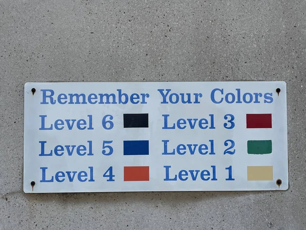 Parking deck elevator wall sign directions colorful Georgia USA