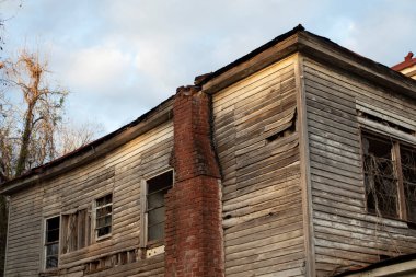 Old wooden weathered dilapidated abandoned two story house Georgia USA