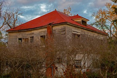 Old wooden weathered dilapidated abandoned two story house Georgia USA