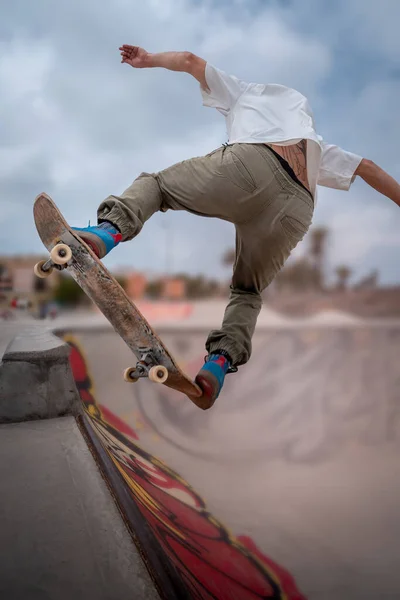 Young Skateboarder Makes Trick Called Blunt Fakie Skatepark Vertical Composition — Stockfoto