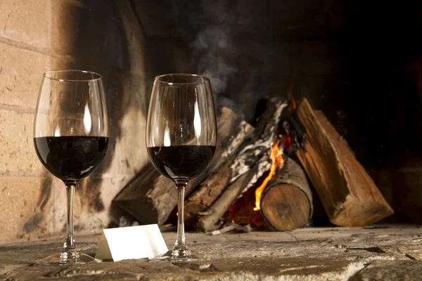 Wine by the fireplace — Stock Photo, Image