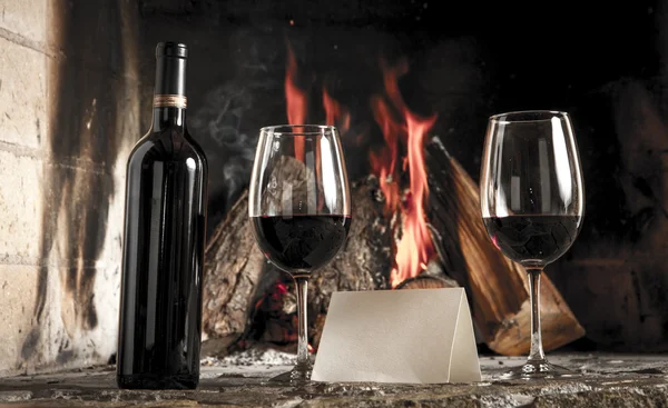 Wine by the fireplace — Stock Photo, Image