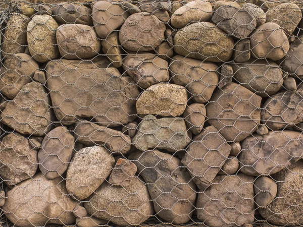 Detaljer om en gabions struktur. Tekst – stockfoto