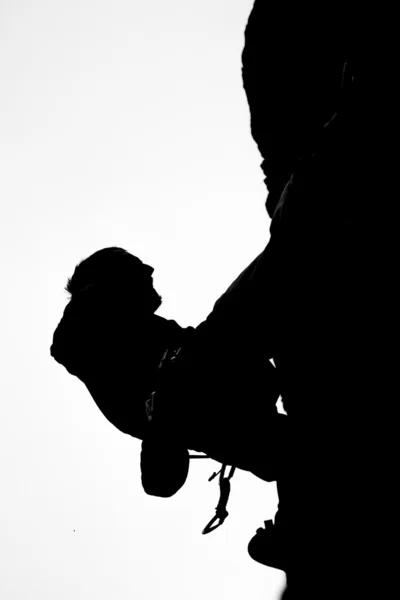 Silhouette arrampicata su roccia — Foto Stock