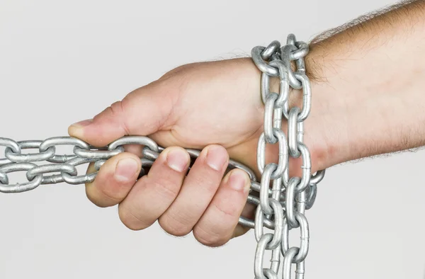 Chain and hand. — Stockfoto