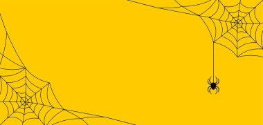 Sarı zemin üzerinde örümcek olan siyah örümcek ağı. Kopya alanı olan Cadılar Bayramı çerçevesi