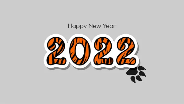 Mutlu yıllar 2022 tebrik kartı. 2022 numara, turuncu ve siyah kaplan desenli gri arka planda kaplan pençesi izi var. Kaplan yılının sembolü.