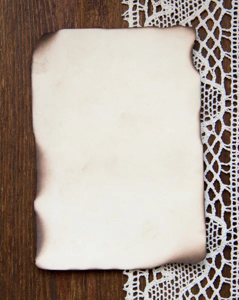 Vintage burned paper card and crochet lace — Stock Photo, Image