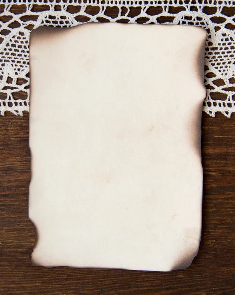 Vintage burned paper card and crochet lace — Stock Photo, Image