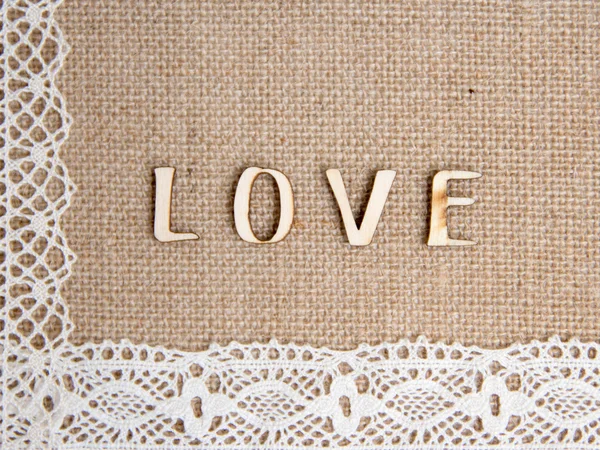 Ordet kärlek på säckväv — Stockfoto