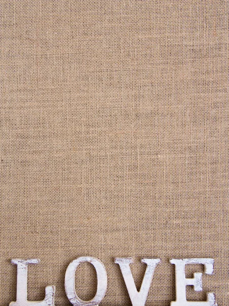 Ordet kärlek på säckväv — Stockfoto