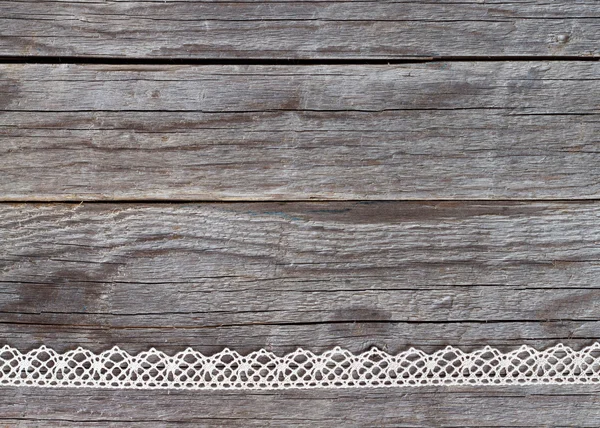 Lace on old wood background — Stock Photo, Image