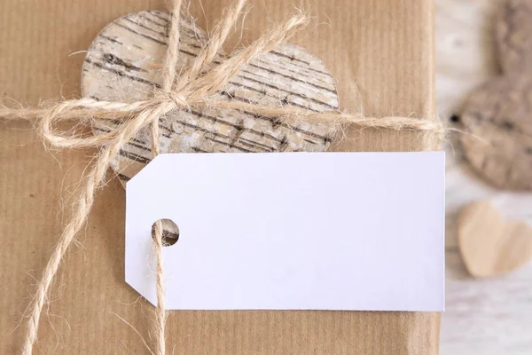 Valentines Kraft Paper Wrapped Present Horizontal Gift Tag Hanging Rope — Zdjęcie stockowe