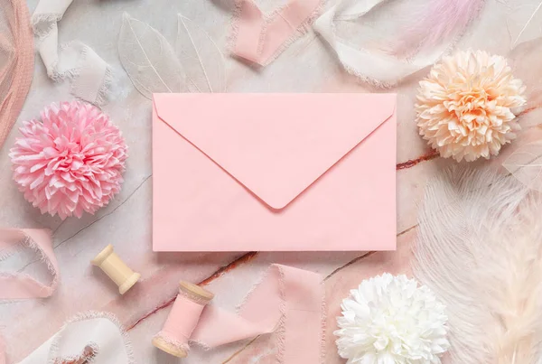 Pink Envelope Pastel Flowers Silk Ribbons Feathers Marble Top View — Stock Fotó