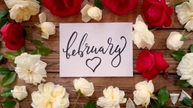 FEBRUARY card on a wooden table top view zoom in