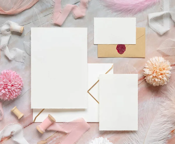 Blank Cards Envelopes Pastel Flowers Silk Ribbons Feathers Marble Top — 图库照片