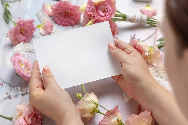 Woman Hands Holding Blank Paper Card Pink Flowers Table Close — Stock Photo, Image