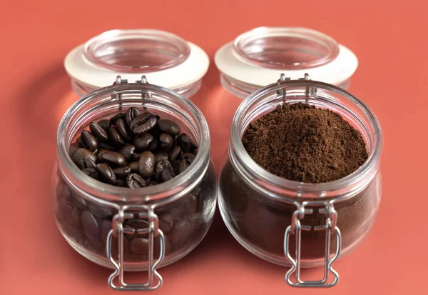 Roasted Coffee Beans Grinded Coffee Glass Jars Close Pink Background — Stock Photo, Image