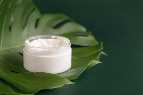 Opened White Jar Monstera Leaf Green Table Close Brand Packaging — Fotografia de Stock