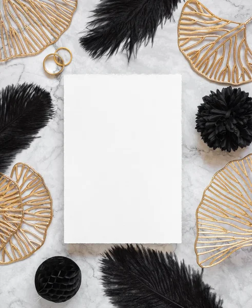 Blank Card Marble Table Black Feathers Golden Leaves Wedding Rings — Stock Photo, Image