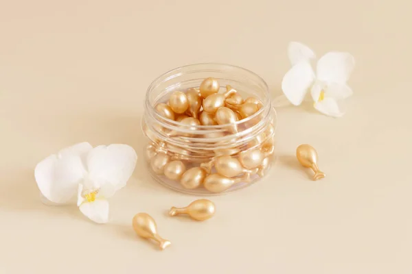 Beauty Serum Capsules Jar White Orchid Flowers Light Yellow Close — Foto Stock