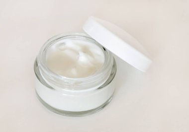 Opened Cosmetic jar with a lid on white close up, mockup. Cosmetic packaging Mockup. Natural homemade cosmetics, monochrome composition, everyday skincare routin