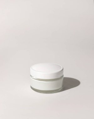 Cosmetic jar with a lid on white close up, mockup. Cosmetic packaging Mockup. Natural homemade cosmetics, monochrome composition, everyday skincare routin