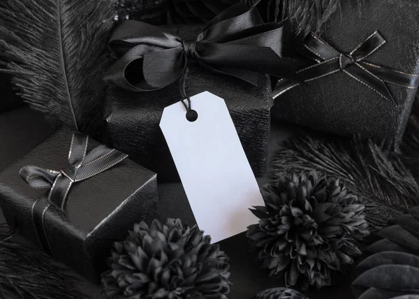 Wrapped Gift Boxes Black Paper Flowers Decorations Vertical Gift Tag — Stock fotografie