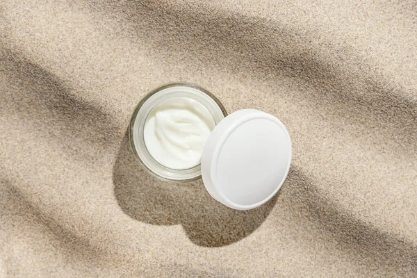 Opened Cream Jar White Lid Beige Sand Top View Hard — Stock Photo, Image