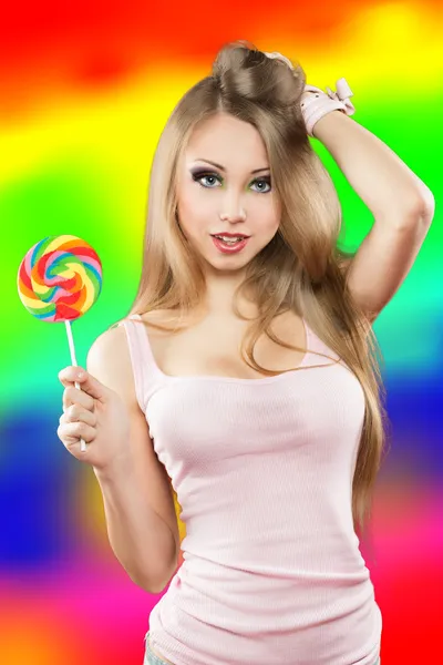 Girl with lollipop. a colorful background — Stock Photo, Image